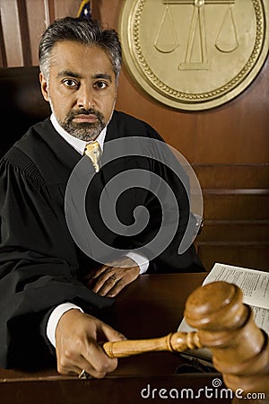 Judge Holding Gavel Stock Photo
