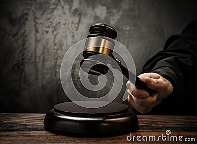 Judge holding hammer Stock Photo