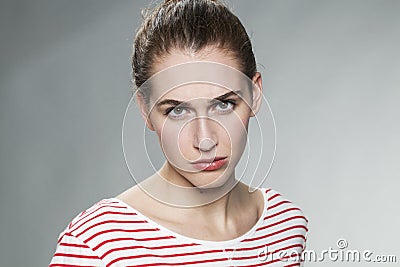 Judge mental concept for sulking 20s woman Stock Photo