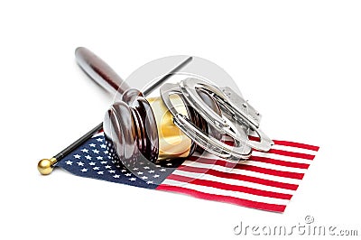 Judge`s gavel with handcuffs and american flag on white. American laws concept Stock Photo