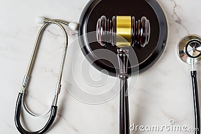 A judge's gavel and a physician's stethoscope. access and entitlement to health care regardless of race, religion Stock Photo