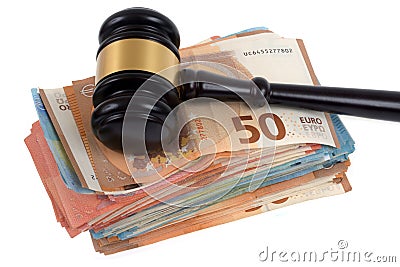 Judges gavel resting on wad of euro banknotes close-up on white background Stock Photo