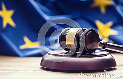 Judges wooden gavel with EU flag in the background. Symbol for jurisdiction Stock Photo