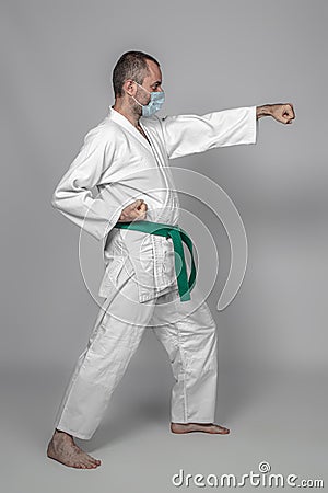 Judo practitioner wears a protective mask Stock Photo