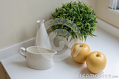 A jug with bottle, apple and decorativ Stock Photo