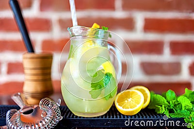 Jug of fresh summer mind lemonade with ingredients Stock Photo