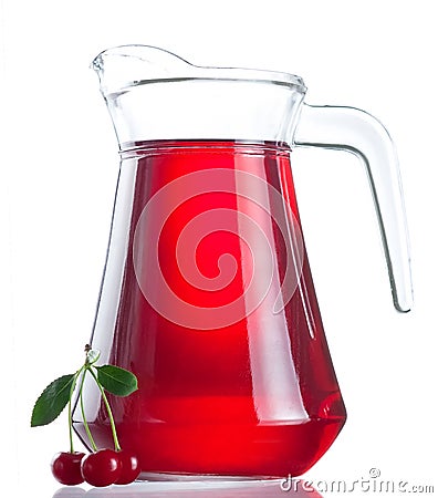 Jug of juice and three ripe cherries Stock Photo