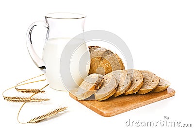 Jug with milk, bread and wheat Stock Photo