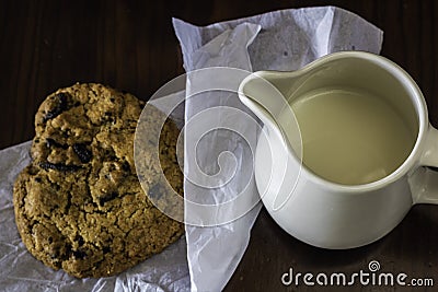 Jug of milk with handmade chocolate cookie Stock Photo