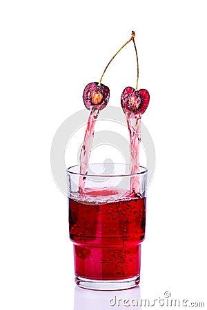 Juice being poured into a glass of cherry Stock Photo