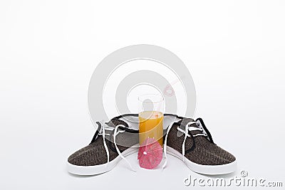Juice and sneakers Stock Photo