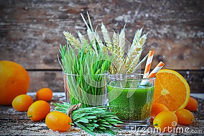 Juice Wheatgrass with orange in the glass Stock Photo