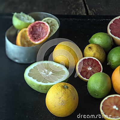 Juicing a selection of fresh citrus fruit Stock Photo