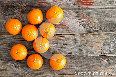 Juicy fresh clementines on a rustic wooden table Stock Photo