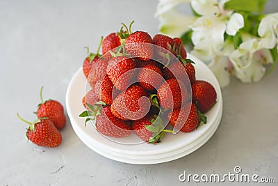 Juicy Fresh Strawberries White Plates Textured Cement Background Summer Fruit Vitamine Fresh Organic diet Stock Photo