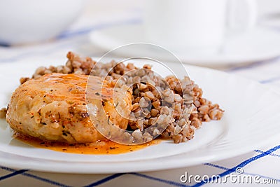 Juicy meat cutlet with tomato sauce with buckwheat Stock Photo