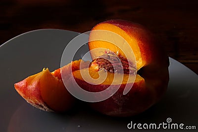 Juicy peach on black Stock Photo