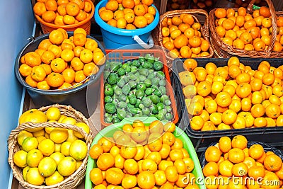 Juicy ripe fruit, tangerines, lemons and feijoa Stock Photo