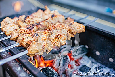 Juicy slices of meat with sauce prepare on fire shish kebab . BBQ outside. Stock Photo