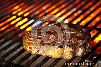 Juicy steak on barbecue Stock Photo