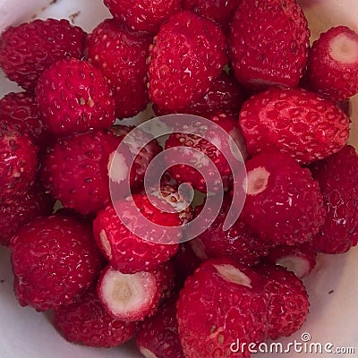 Juicy strawberries collected in a meadow Stock Photo