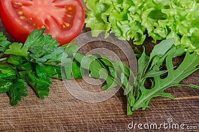 Juicy tomatoes with green-stuff Stock Photo
