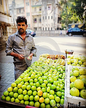 Jujube seller in the bylaws of Bandra, Mumbai Editorial Stock Photo