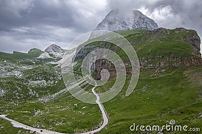 Julian Alps mountain Mangart from Mangrt saddle, Slovenia's Highest Panoramic Road, foggy weather Stock Photo