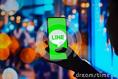 July 27, 2022, Brazil. In this photo illustration, the Line Corporation logo is displayed on a smartphone screen Cartoon Illustration