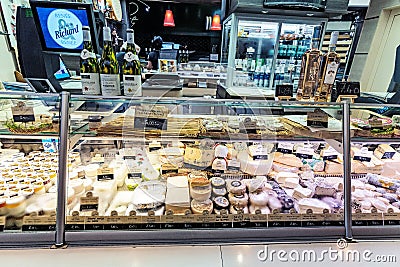 Cheese assortment at the showcase of modern market in Lyon Editorial Stock Photo