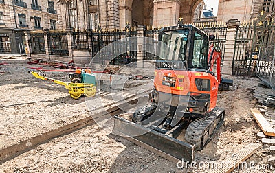 The road is closed for reconstruction, on the roadside parked small rollers pavers Editorial Stock Photo