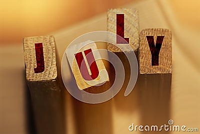 July month on wooden blocks. Month events schedule or important dates concept Stock Photo
