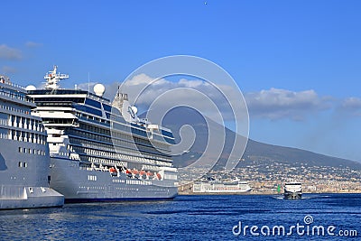 July 14 2021 - Naples, Italy: Port of Naples with cruise ships in front of the vesuv mountain Editorial Stock Photo