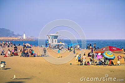 Beach goers enjoying a sunny summer afternoon Editorial Stock Photo
