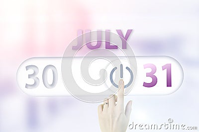 July 31st . Day 31 of month, Calendar date.Hand finger switches pointing calendar date on sunlight office background. Summer month Stock Photo