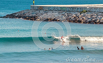 People surfers rides the sea wave. Extreme sport and hobby concept Editorial Stock Photo