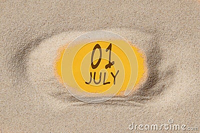 July 1. 1th day of the month, calendar date. Hole in sand. Yellow background is visible through hole Stock Photo