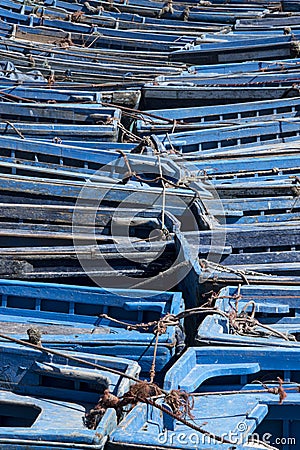 jumble of small blue fishing bats huddled together in port Stock Photo