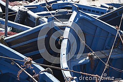 jumble of small blue fishing bats huddled together in port Stock Photo