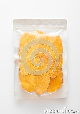 Jumbo pack of dried large sweet mango slices on white background Stock Photo