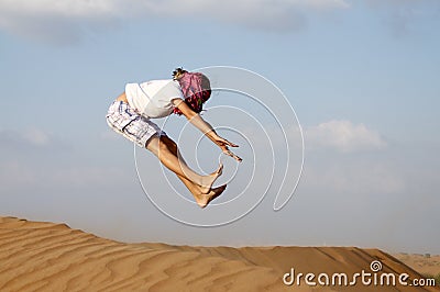 Jump and fun in the desert dunes Stock Photo