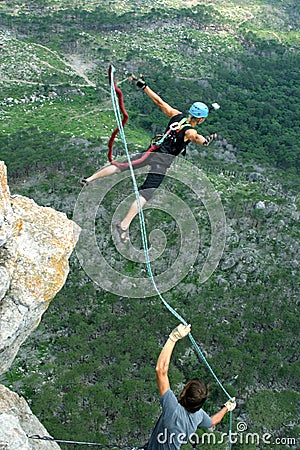 Jump off a cliff with a rope.Bungee jumping Stock Photo