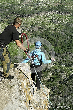 Jump off a cliff with a rope.Bungee jumping Stock Photo