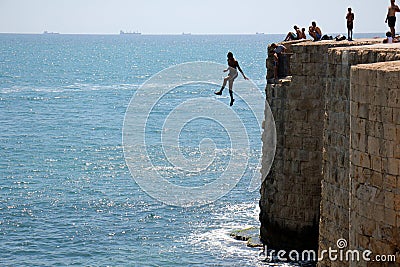 Jump off the wall Editorial Stock Photo