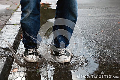 Jump in the puddle Stock Photo