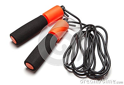 Jump rope. Fun exercises for body health. Orange rope with black cord. Isolated on white background Stock Photo