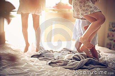 Jumping on bed. Stock Photo