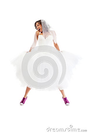 Jumping bride with sneakers Stock Photo