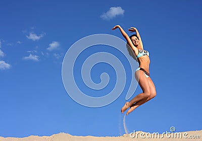 Jumping happy girl Stock Photo