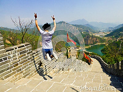 Jumping on Huanghuacheng Lakeside Great Wall section Stock Photo